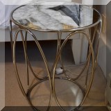 F34. Round silver side table. 20”h x 17”w 